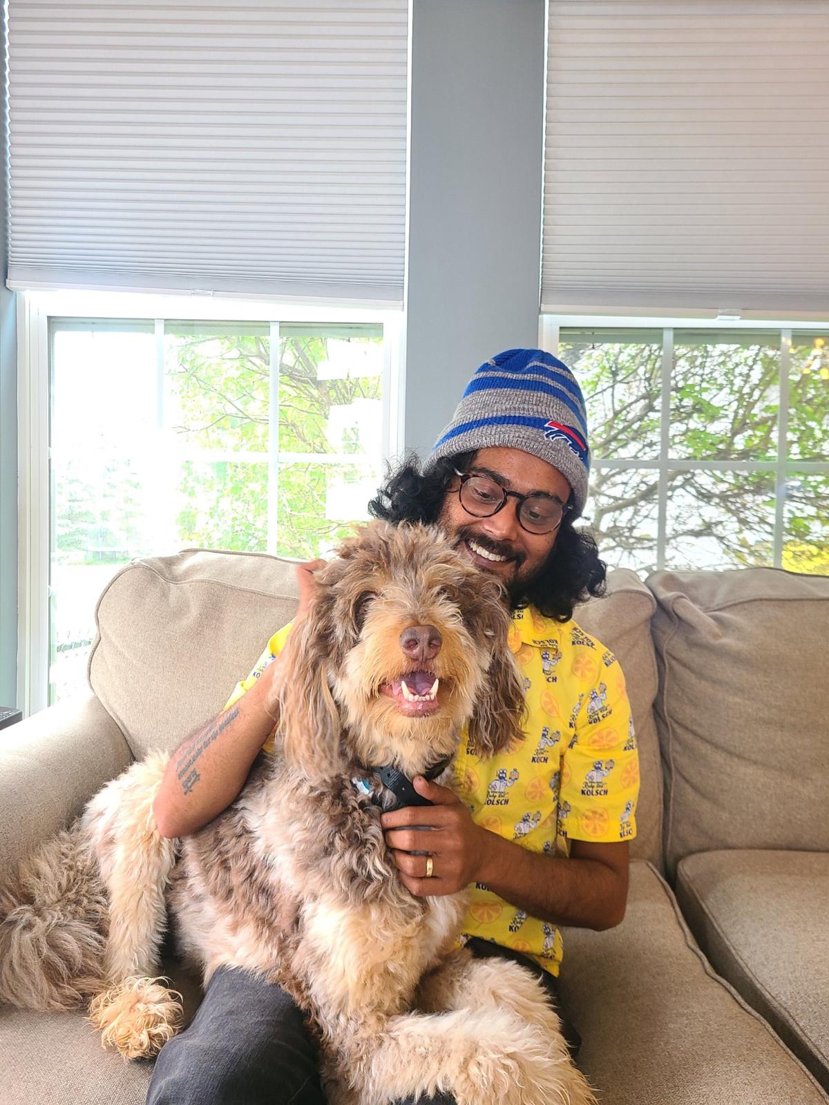 Shivam Khare at home with his dog